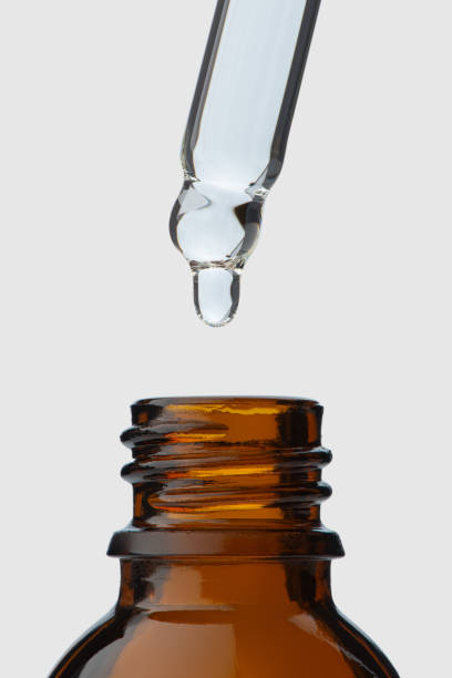 istock Cosmetic pipette with oil, macro 2203675603