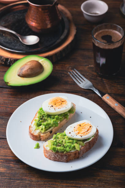 istock Avocado toast with cream cheese and boiled egg for breakfast 2203676804