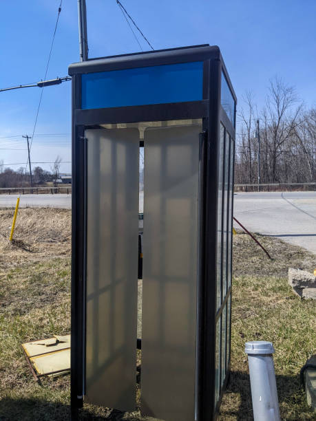 istock Outdoor Abandoned Telephone Booth Structure on a Rural Roadside in Bright Daylight 2203678834