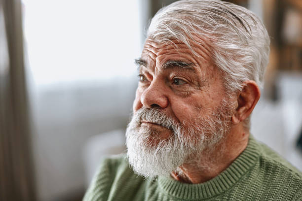 istock A pensioner sits at the dining room table and works on a laptop 2203686591