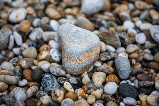 istock Rocks and pebbles along Marazion Beach in Cornwall, UK. 2203687117