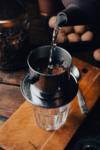 istock Pouring hot water into a Vietnamese coffee filter 2203688322