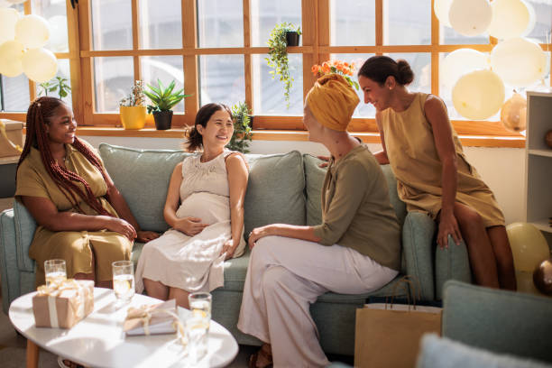 istock Diverse Women Enjoying Conversation at Baby Shower 2203689150