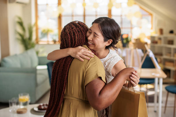istock Expecting Mom Hugging her Friend 2203691109