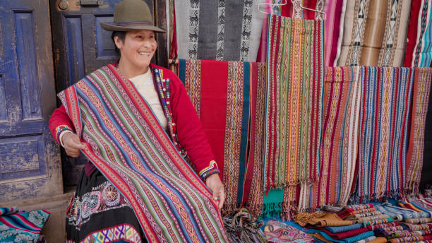 istock Peruvian woman selling souvenirs in Pisac, Urubamba Valley 2203705073