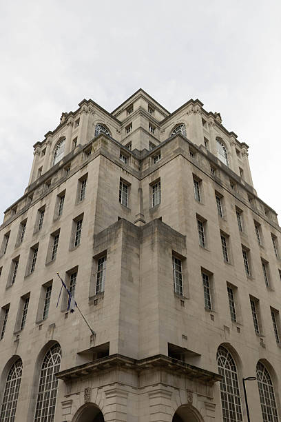istock A building with architecture in classic English style made of light-colored stone. 2203706824