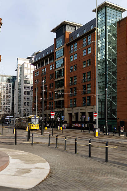 istock Urban landscape with traffic moving between high-rise British buildings. 2203706903