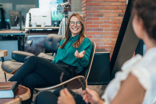 istock Business women in friendly conversation 2203712233