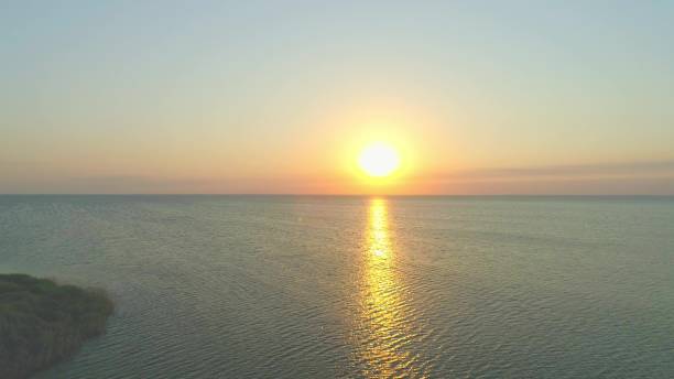 istock Bright sun rise above sea, drone view 2203712527
