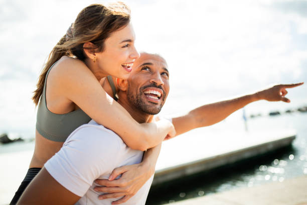 istock Playful Couple by the Water 2203712728