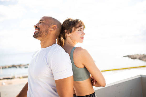 istock Relaxed Man and Woman by the Ocean 2203712752