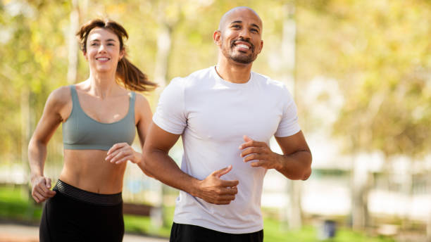 istock Couple's Morning Run in the Park 2203712780