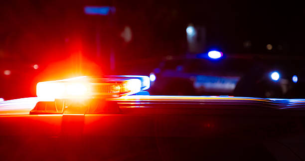 istock Police flashing lights at crime scene 2203714951