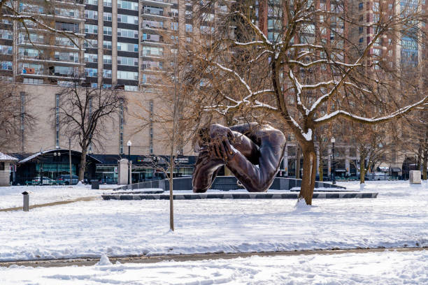 Boston, MA, USA - 11 February 2025 - The Embrace, a bronze sculpture by Hank Willis Thomas, installed on Boston Common in Boston, Massachusetts, United States in December 2022