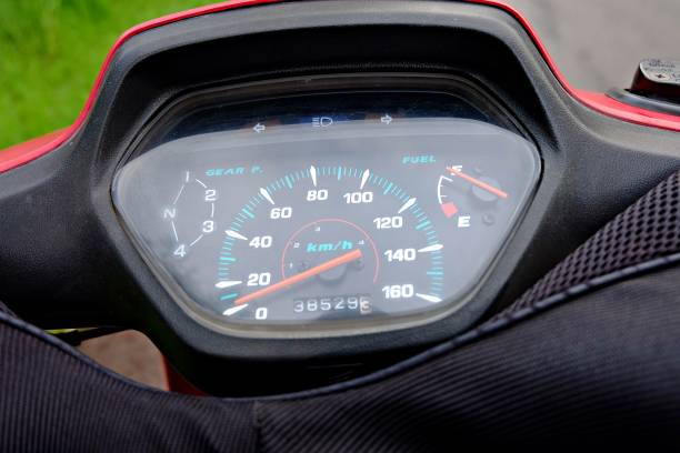 close up of a motorcycle with a red ometer