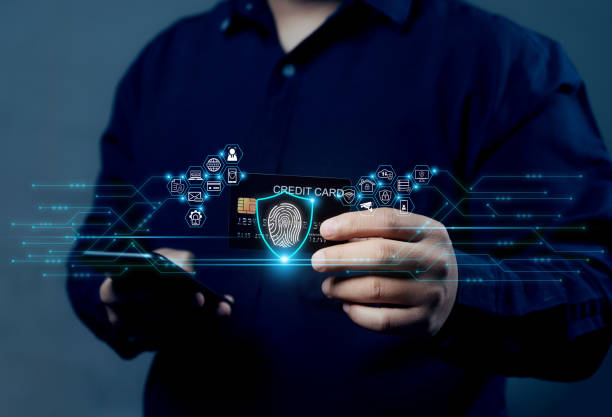 istock Credit card cybersecurity and privacy to protect data. Businessman protecting personal information. Fingerprint lock icon and internet network security technology. 2203722540