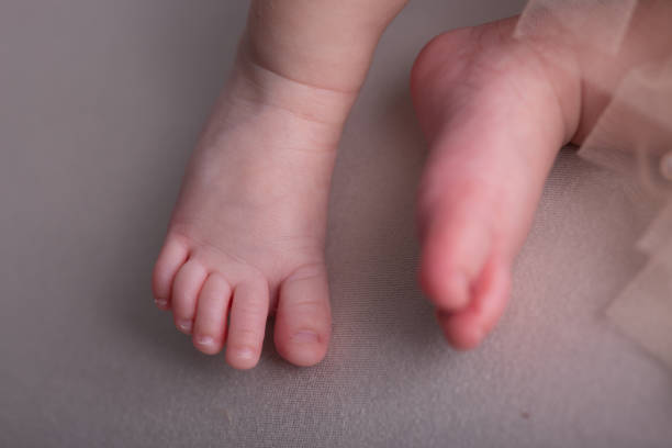 istock Newborn baby feet close up 2203723332