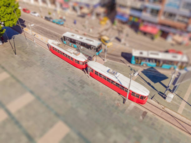 Nostalgic retro tram at central Muratpasa district. Old tram is a popular tourist attraction in Antalya. Drone view.