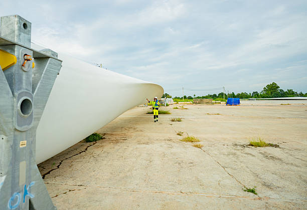 istock Wind turbine blade assembly at a renewable energy facility during daylight hours 2203729518