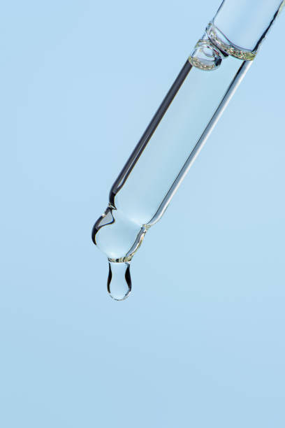 istock Cosmetic pipette with oil, macro 2203730415