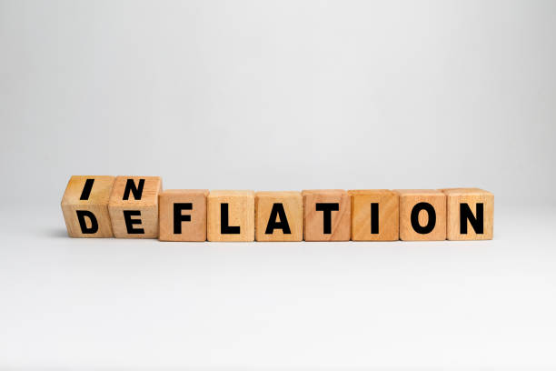 istock inflation and deflation on turn wooden blocks isolated on white background 2203732079