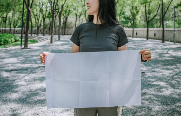 istock Asian women holding blank flags, suitable for designers to use 2203733196