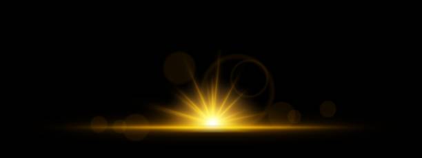 istock Glowing yellow light burst on a dark background. Bright neon explosion with radiant beams, circular bokeh, and energy flare. Abstract illumination with vibrant glow and futuristic effect. 2203734574