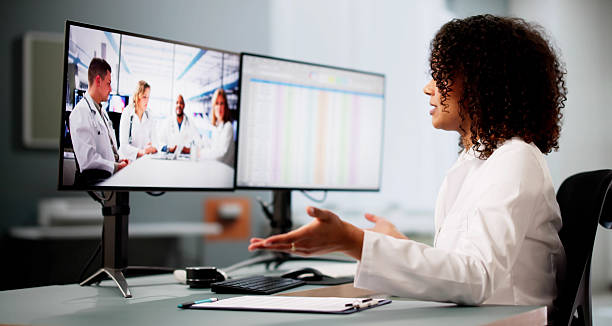 istock Doctor Team Meeting Video Conference Webinar 2203738413