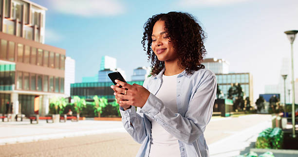 istock Happy Woman Using Cell Phone Or Smartphone Outside 2203740977