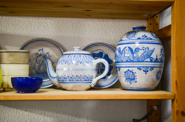 istock Handcrafted pottery displaying traditional blue designs on a wooden shelf 2203741300