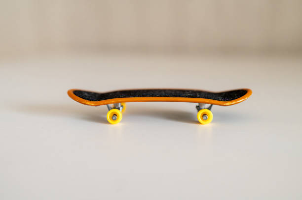 istock children's toy fingerboard on a light background 2203741879