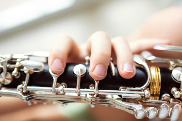 istock close up of child's hands playing clarinet, selective focus 2203741910