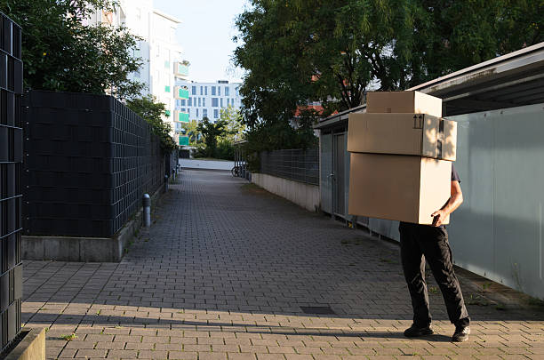 istock Delivery man holds the big boxes. 2203745272