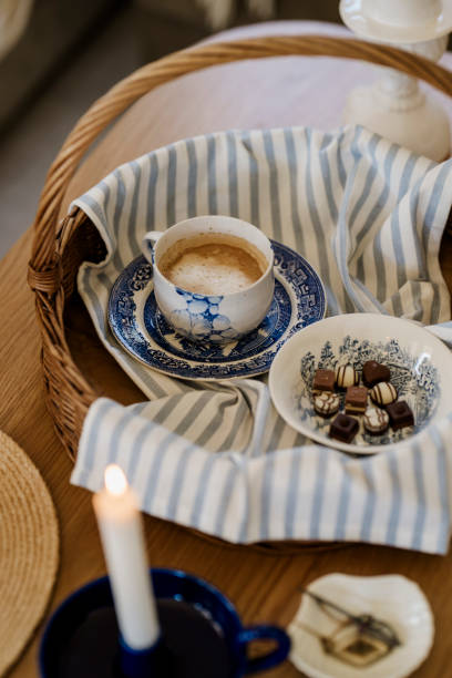 Antiques and coffee cup and chocolates