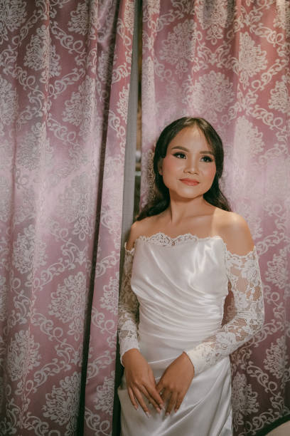 istock Cheerful Young Asian Beautiful Bride in Satin and Lace 2203746533