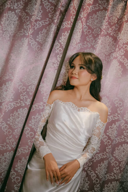 Cheerful Young Asian Beautiful Bride in Satin and Lace