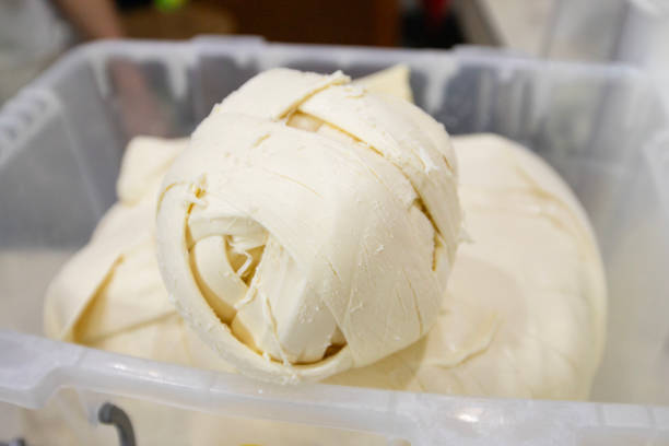 istock Oaxaca cheese, quesillo or string cheese is a fresh and soft cheese, originally from the Central Valleys of the state of Oaxaca. 2203749845