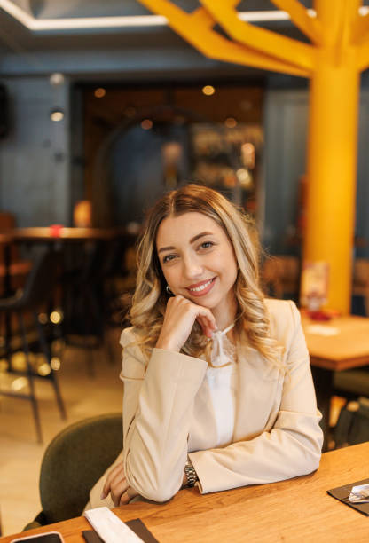 istock Beautiful young woman in restaurant 2203751034