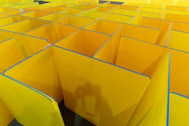 Warehouse for stacking yellow plastic pallets in the factory