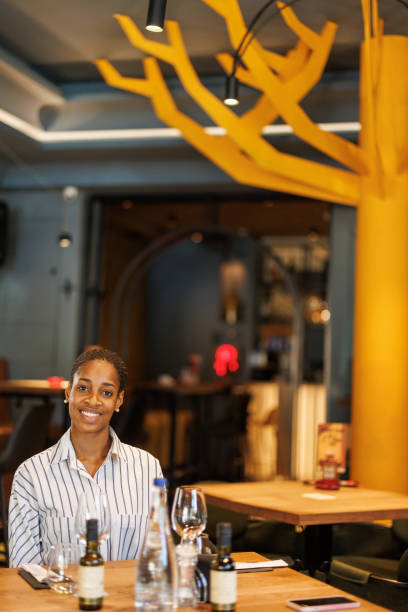 istock Beautiful young woman dining in restaurant 2203751368