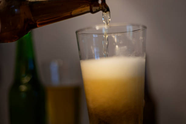 istock Beer Is Poured Into Beer Glass 2203752305