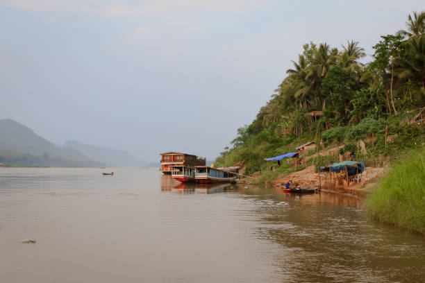 istock Exploring tranquil waters in Mekong Delta, Laos with floating homes and vibrant nature 2203753108