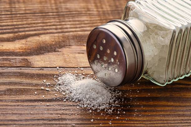 istock Organic salts on wooden background 2203753510