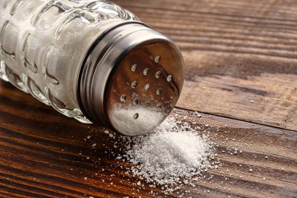 istock Organic salts on wooden background 2203753520