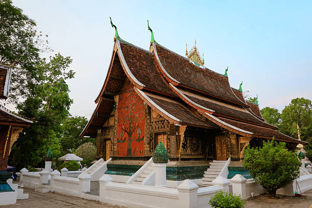 istock Explore the stunning architecture of Wat Xieng Thong in Luang Prabang during sunset hours 2203754088