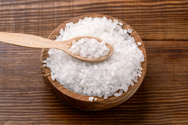 istock Organic salts on wooden background 2203754280