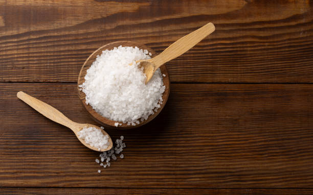 istock Organic salts on wooden background 2203754288
