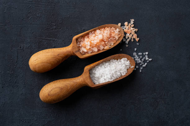 istock Organic salts on black background 2203754561