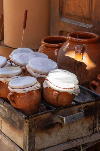 istock morning light on tagine earthenware clay pots covered in cloth on a fire in Marrakesh, Morocco 2203755666