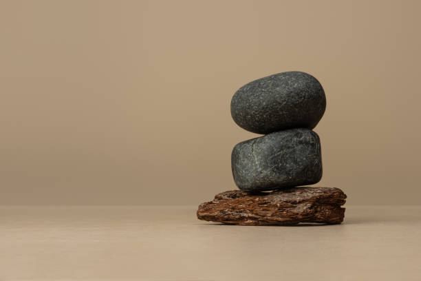 istock Background for cosmetics, stones and tree bark on beige background 2203757734
